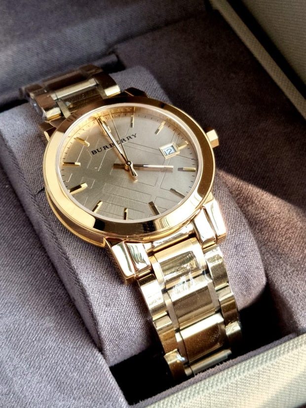 Gold wristwatch in a display box